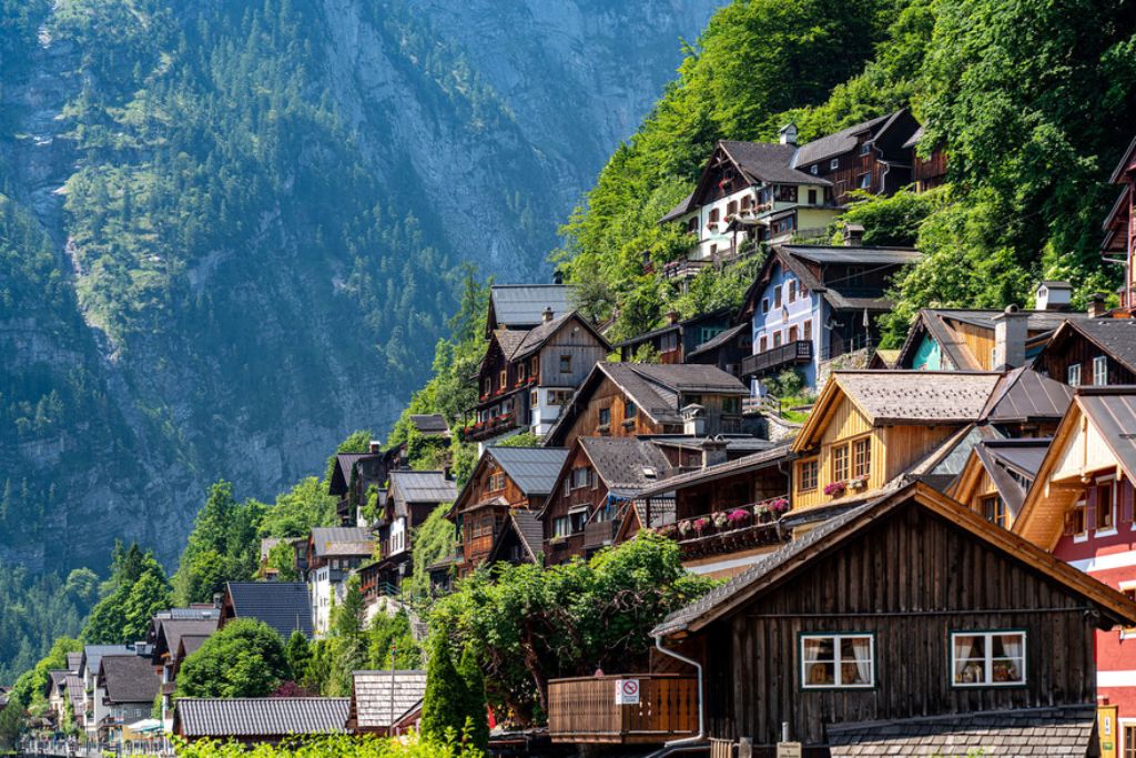 hallstatt colorful town with cliff in background