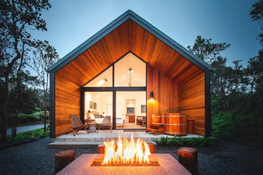 A Modern and Romantic Airbnb at Dusk in Hawaii Featuring a Private Lanai and Floor To Ceiling Windows.