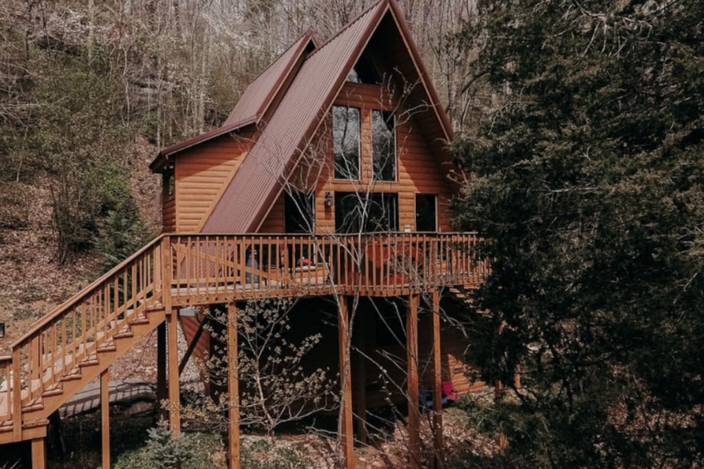 An A-Line Cabin Perched High in the Kentucky Wilderness Overlooking Pine Trees.