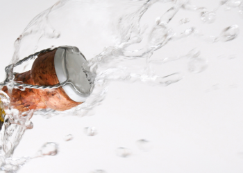Cork popping off the top of a bottle of champagne