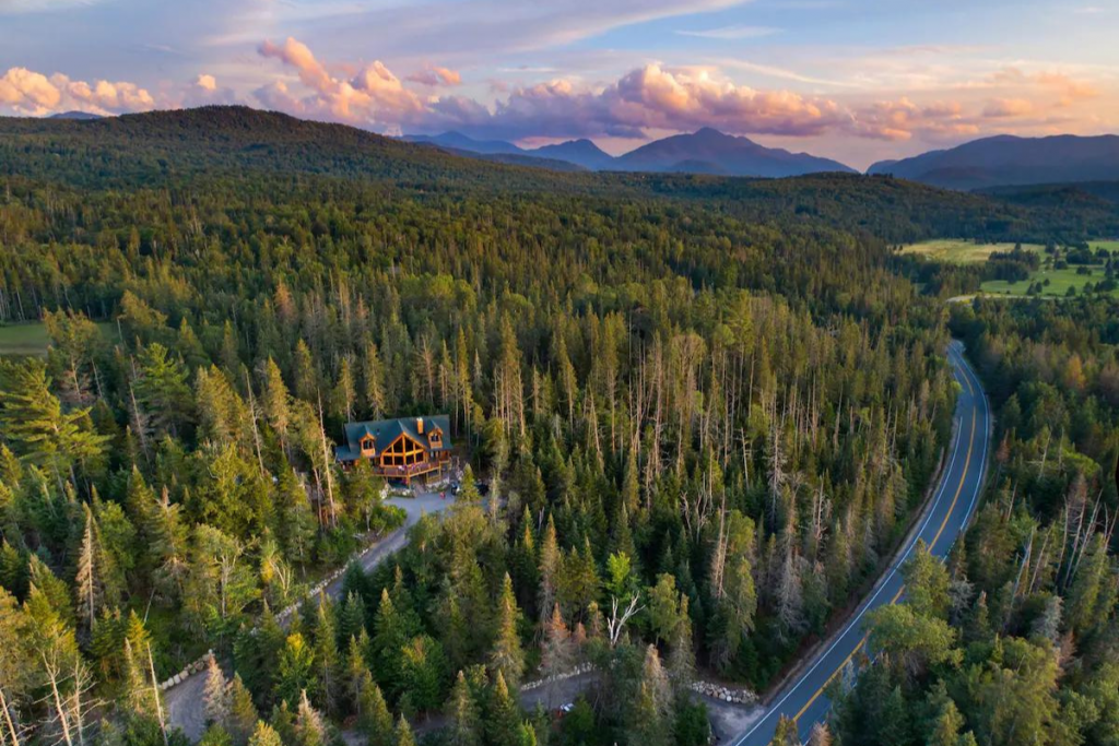 Aerial View of an Adirondacks Airbnb Surrounded by the Forest in River Road Loj, Lake Placid.