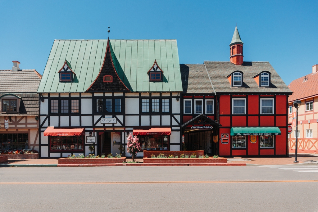 old fashion small town building from a street view and flowers in front