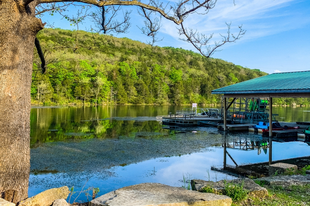 lake in eureka springs with paddle boats and water and rocks