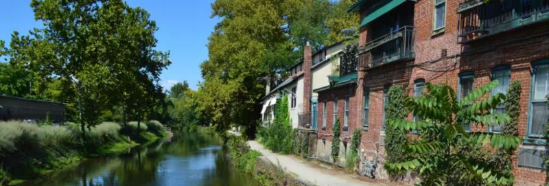 brick building and greenery along delaware river