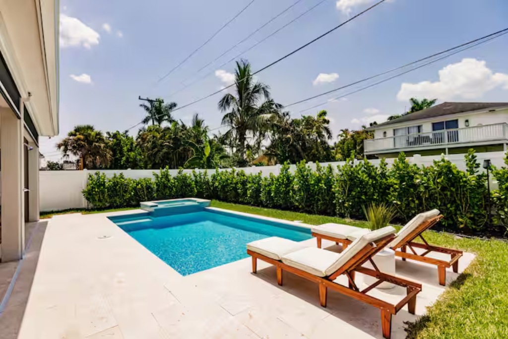 pool with lounge chairs in naples