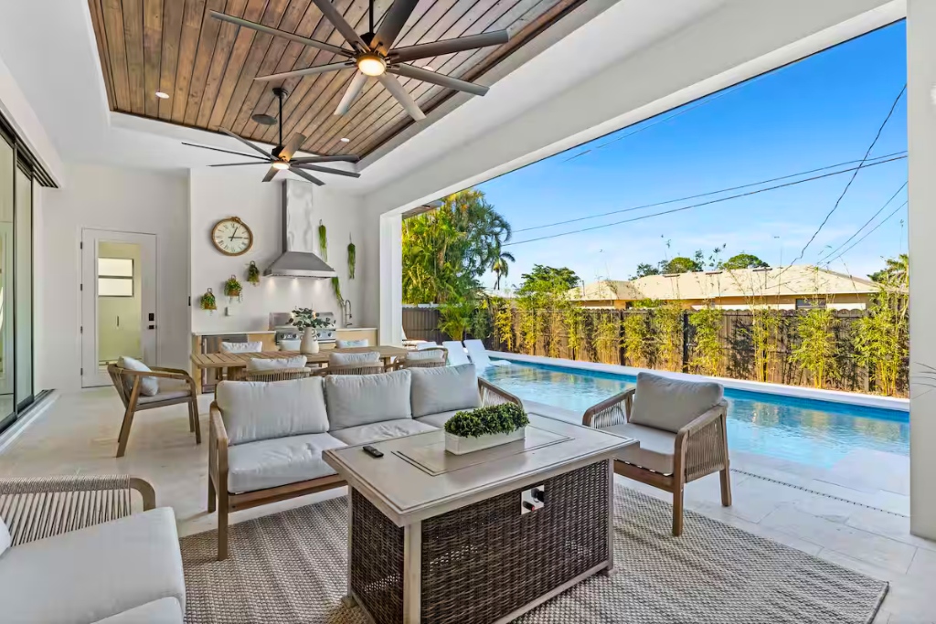 brand new home in naples with patio seating and pool