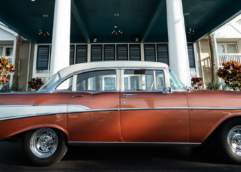 vintage red car parked outside of havana cabana in key west florida