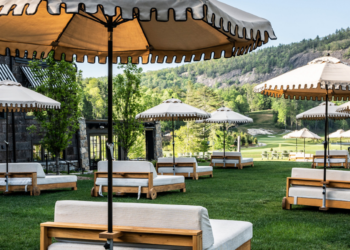 outdoor lounge furniture facing mountains and greenery at high hampton in north carolina