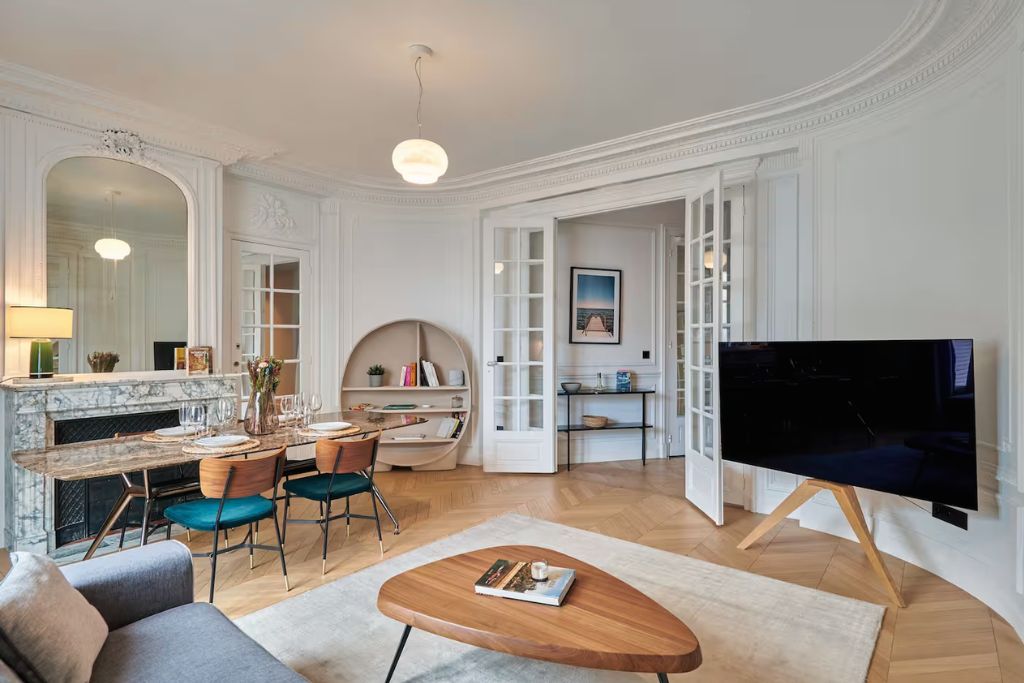 designer paris airbnb with a marble fireplace