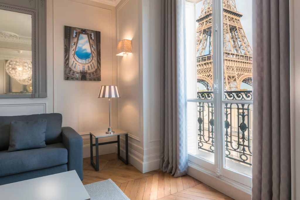 Paris luxury airbnb with a balcony view of the Eiffel tower