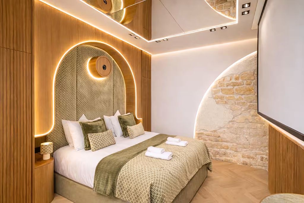le marais paris luxury airbnb bedroom with built-in cinema