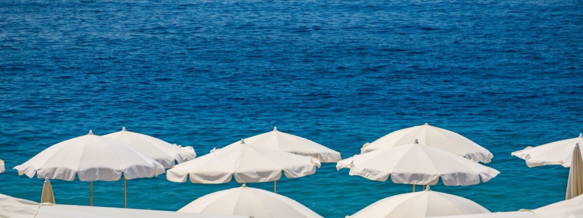 beach umbrellas in front of nice cote dazur ocean