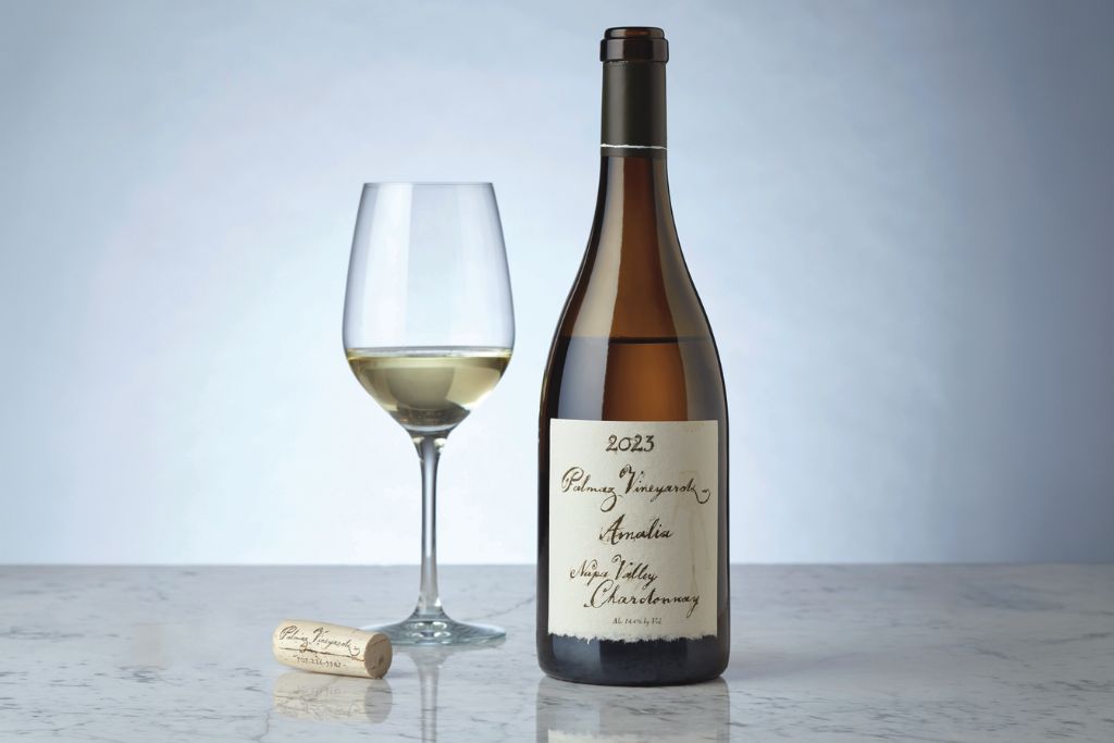 bottle and glass of palmaz 2022 amalia chardonnay