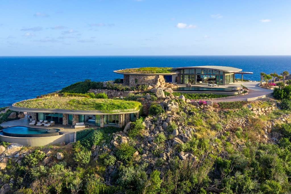 private homes at oil nut bay virgin gorda blend into the mountain-sea scape