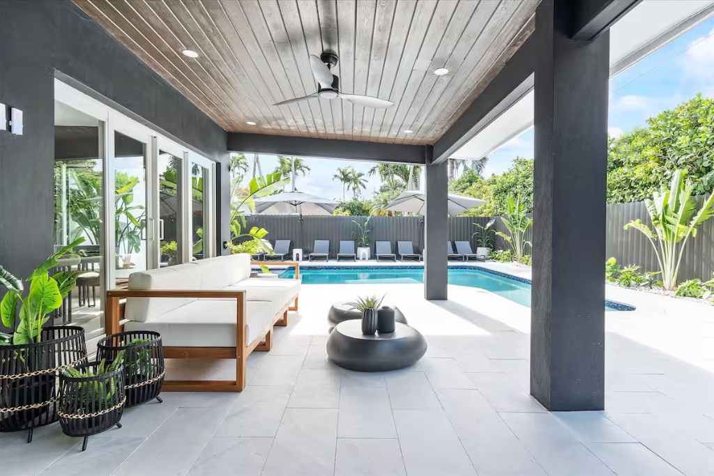 modern two-story villa private patio and swimming pool with a jacuzzi in miami