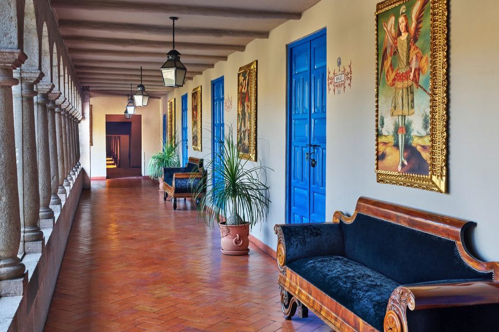 palacio del inka hotel in cusco, peru art-filled hotel hallway