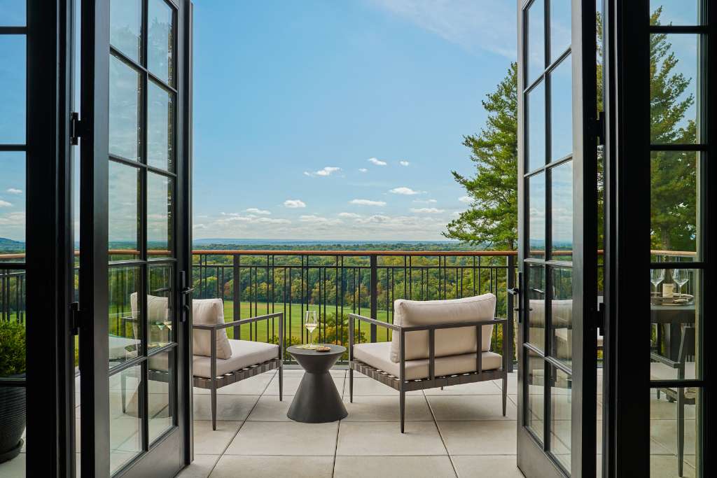 guest room with a terrace view at pendry natirar