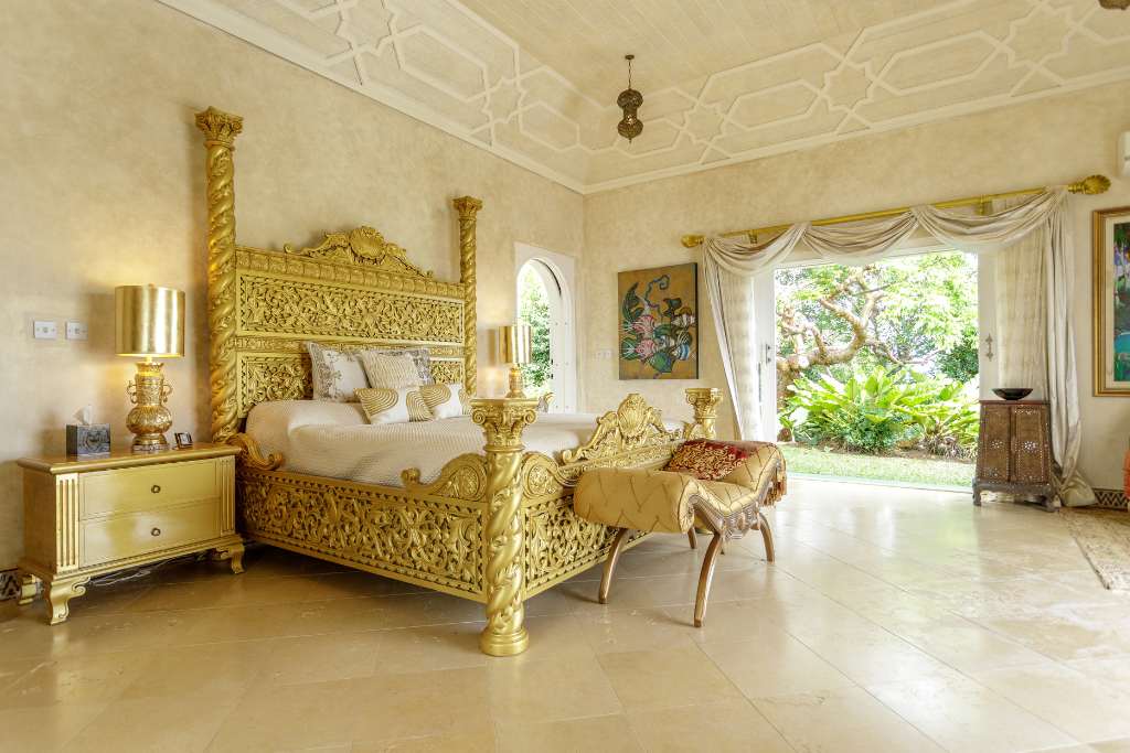 gold bed owner's suite, toucan hill, mustique island