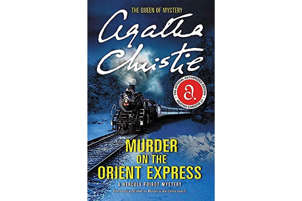 cover of the murder on the orient express which has a blue background with the train and steam coming from it