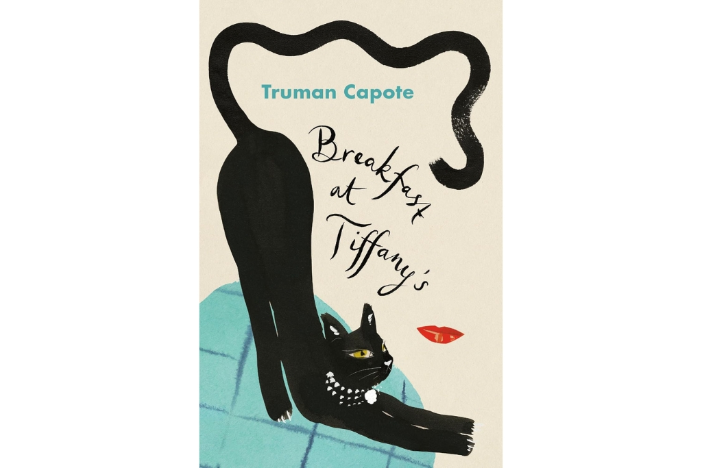 cover of the breakfast at tiffanys with a black cat spanning across the cover