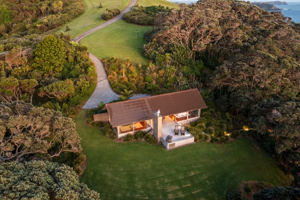 overhead view of a glass home with beach access in new zealand 