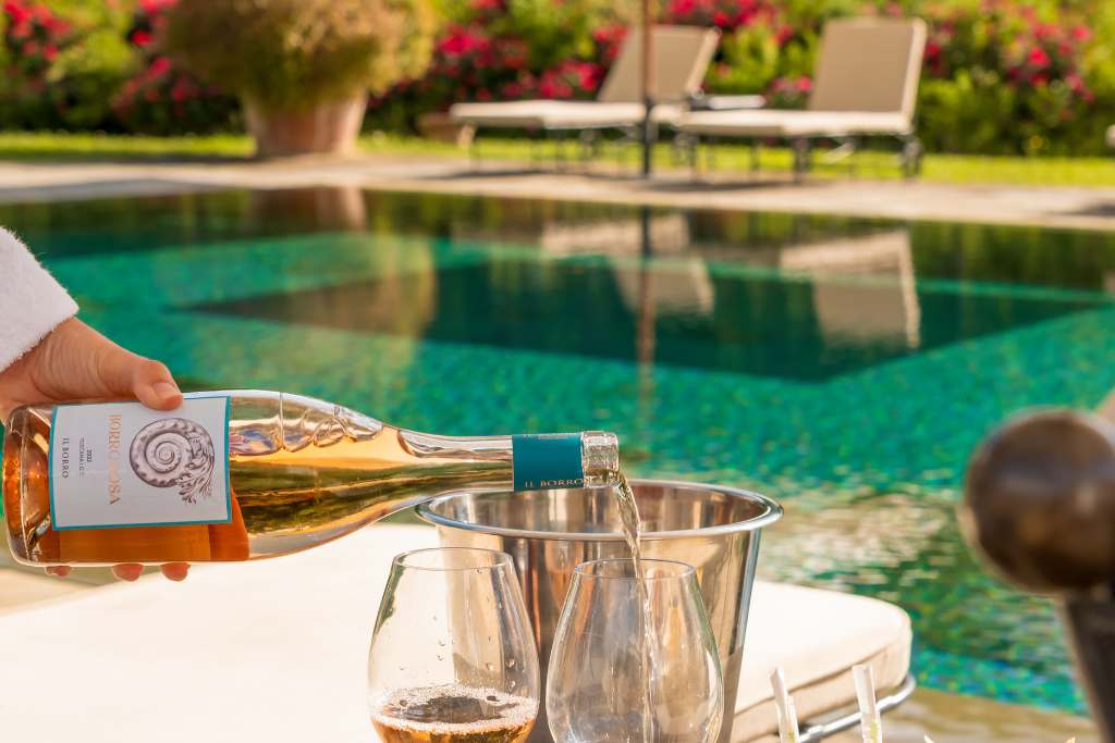 wine poolside at viesca toscana italy