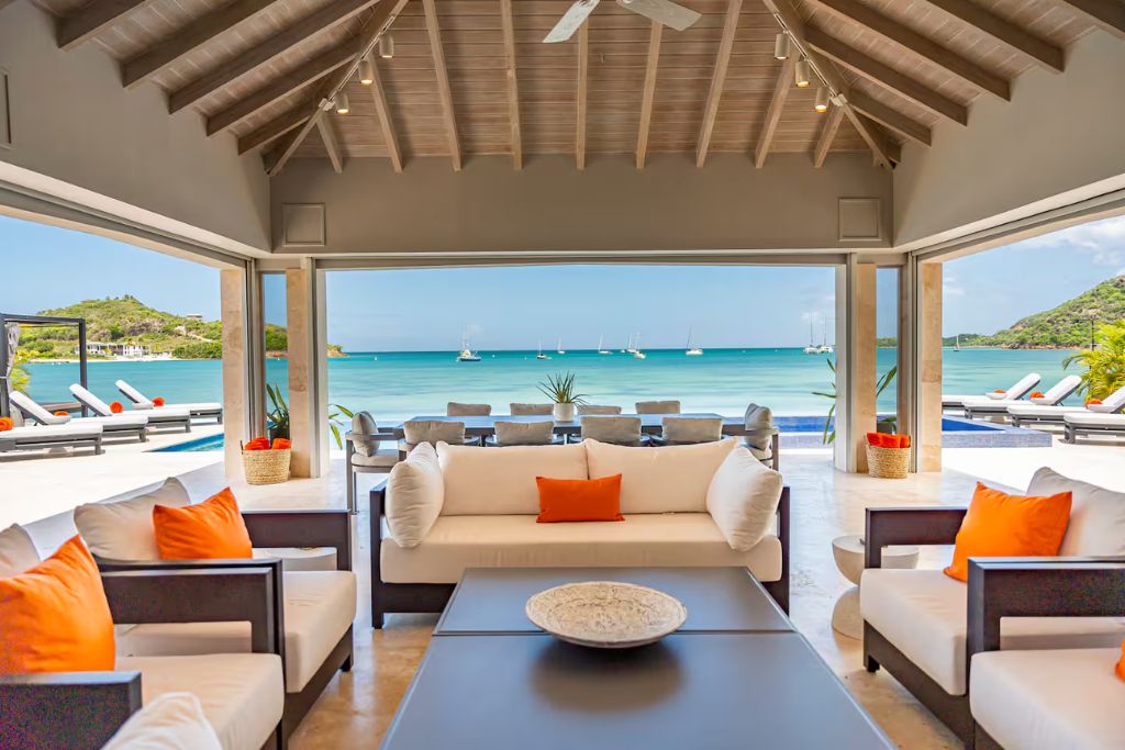 antiqua airbnb outdoor living space with water backdrop
