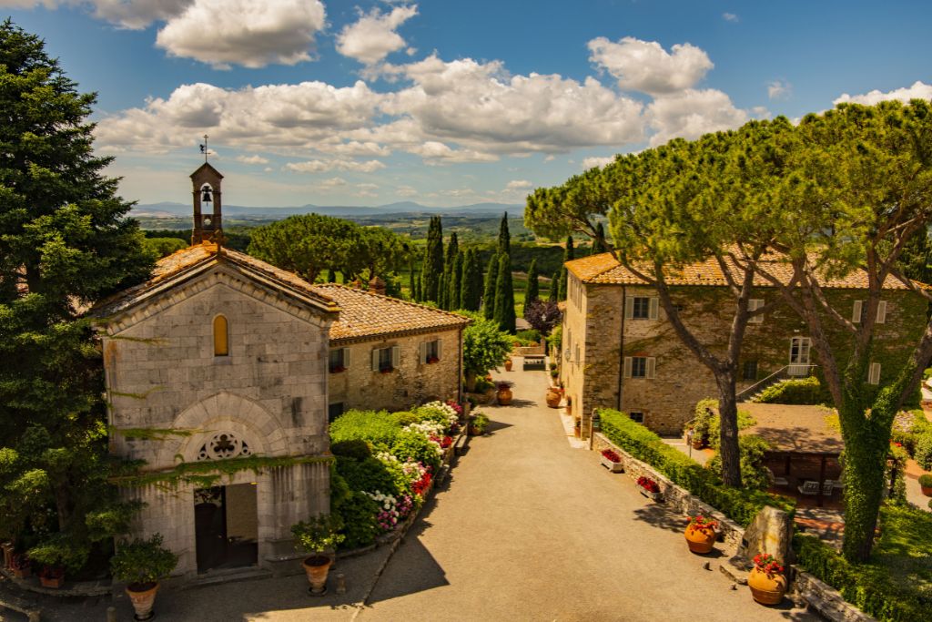 borgo san felice exterior and vineyard in tuscany, italy