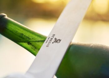 sabering a champange bottle at the st.regis