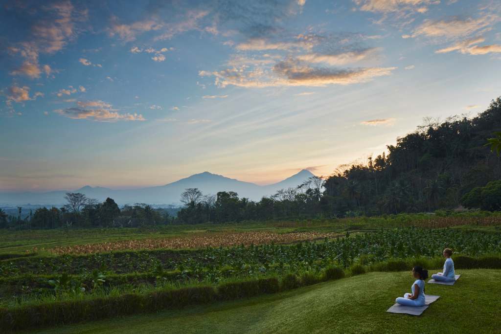yoga and meditation overlooking the rice fields at amanjiwo indonesia