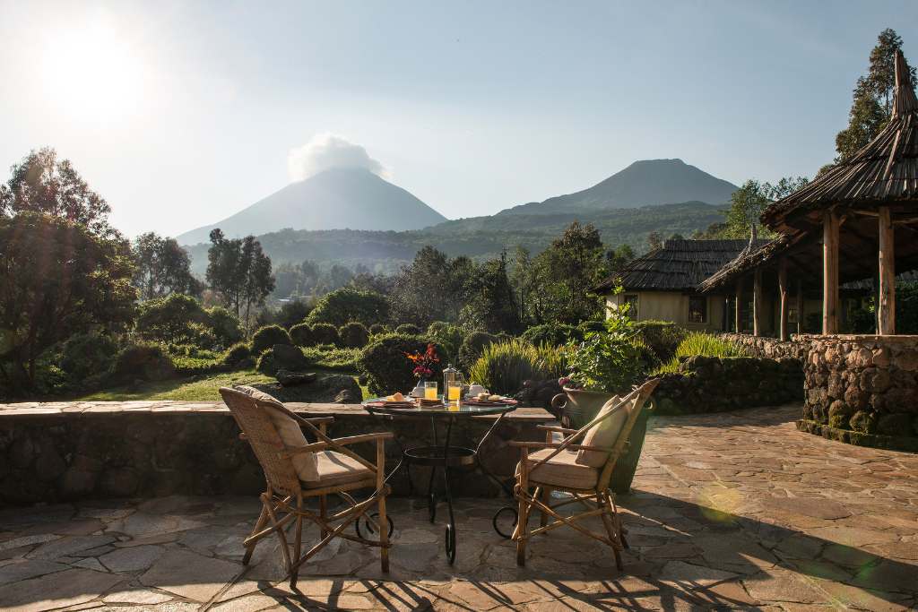 patio overlooking the volcano at mount gahinga lodge uganda