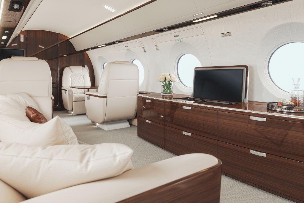 private jet aisle with tv and couch