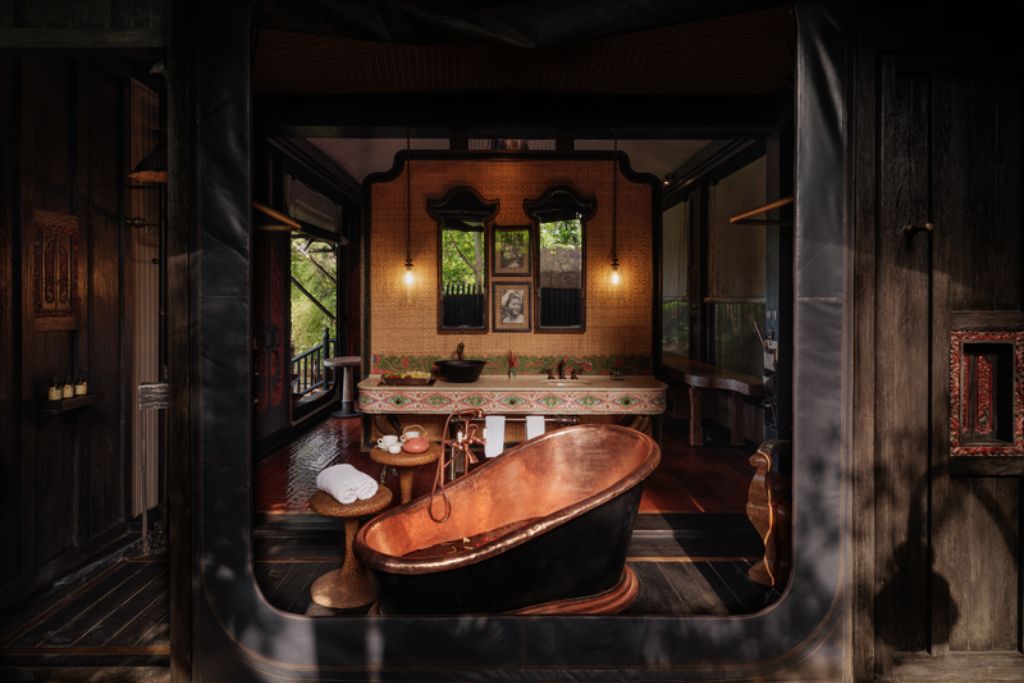 bronze bathtub in large ensuite bathroom in capella ubud bali