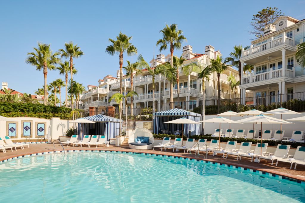 hotel del coronado outdoor pool with lounge chairs and cabanas
