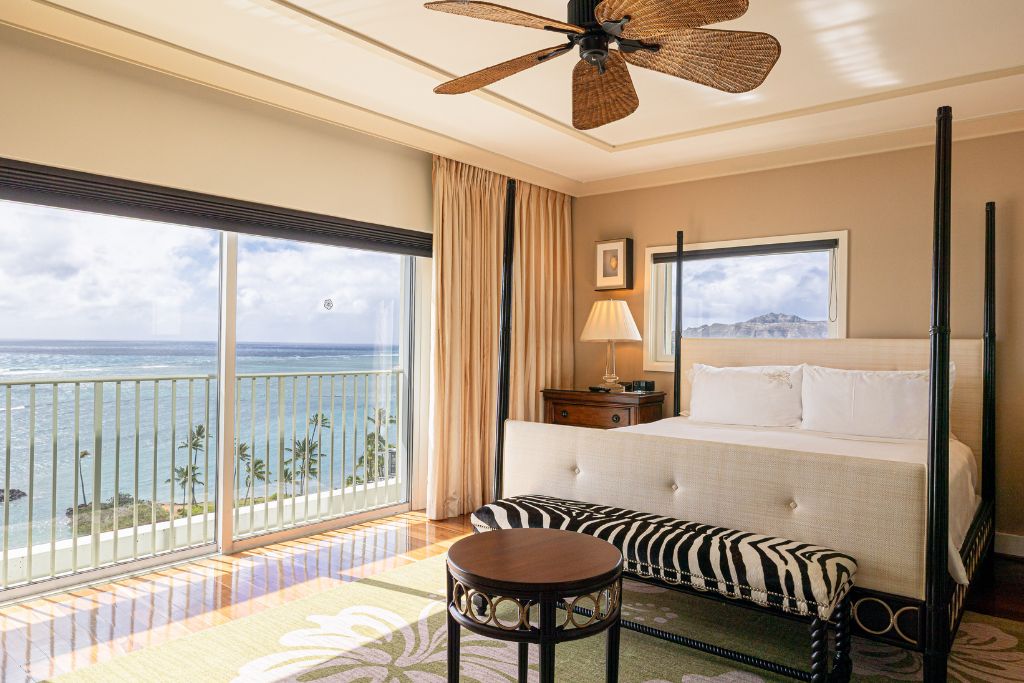 kahala resort bedroom with balcony and ocean view