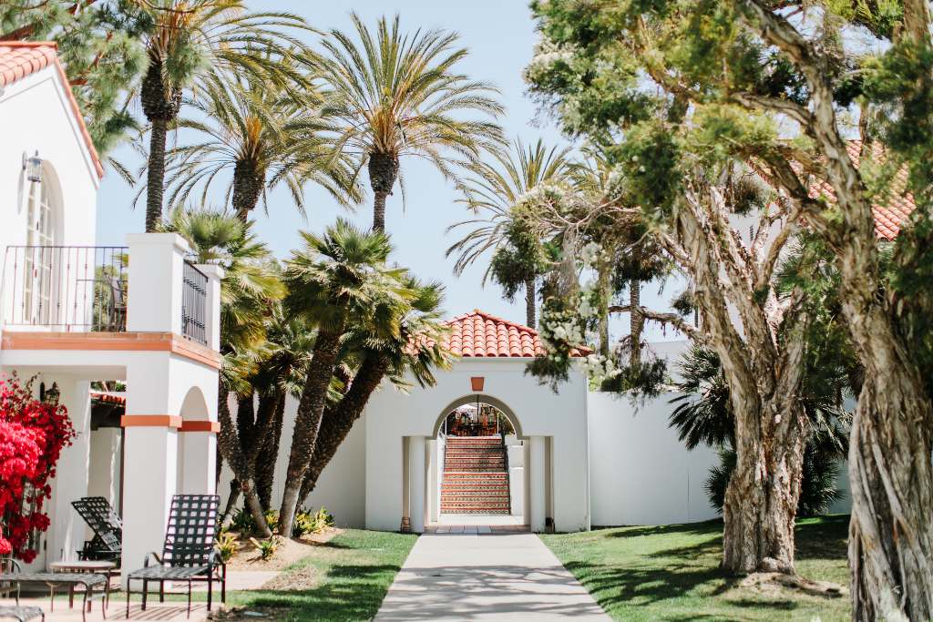dramatic courtyards with palms, live oaks and bougainvillea at omni la costa
