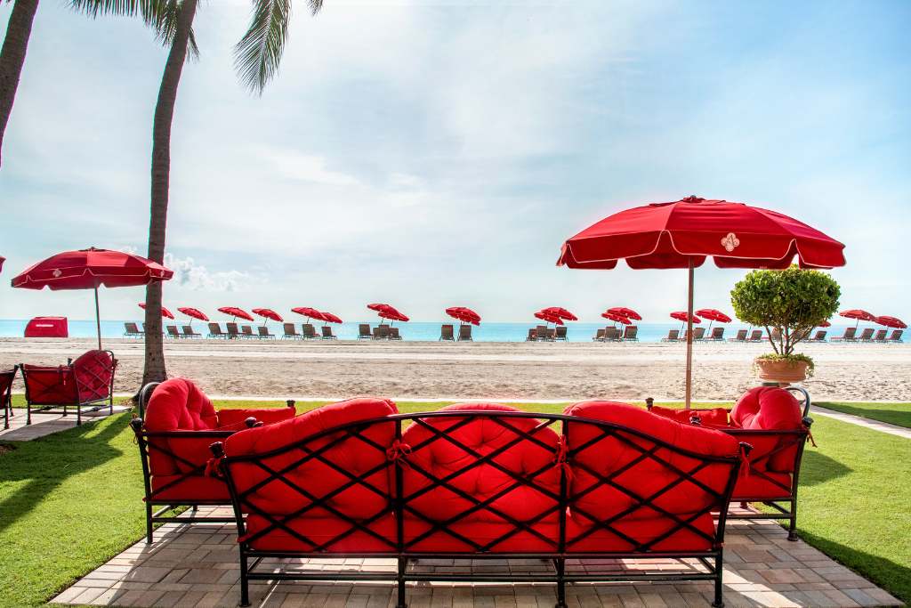alfresco red umbrella living room on the beach at acqualina resort & residences Florida