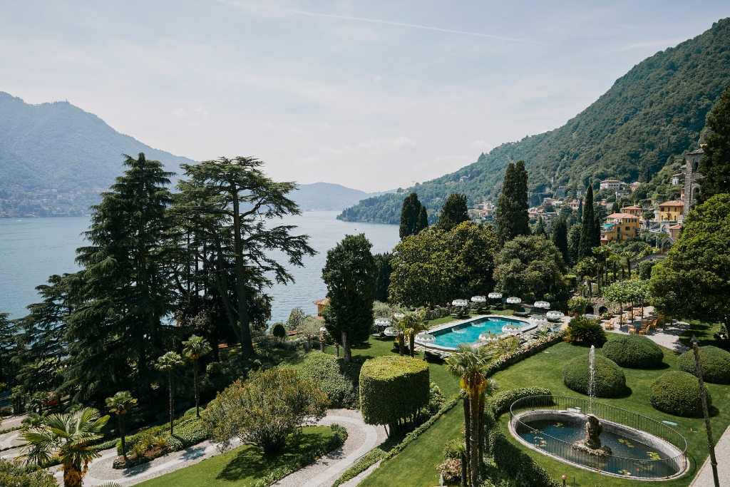 panoramic views of lake, mountains, and pool at passalacqua in italy