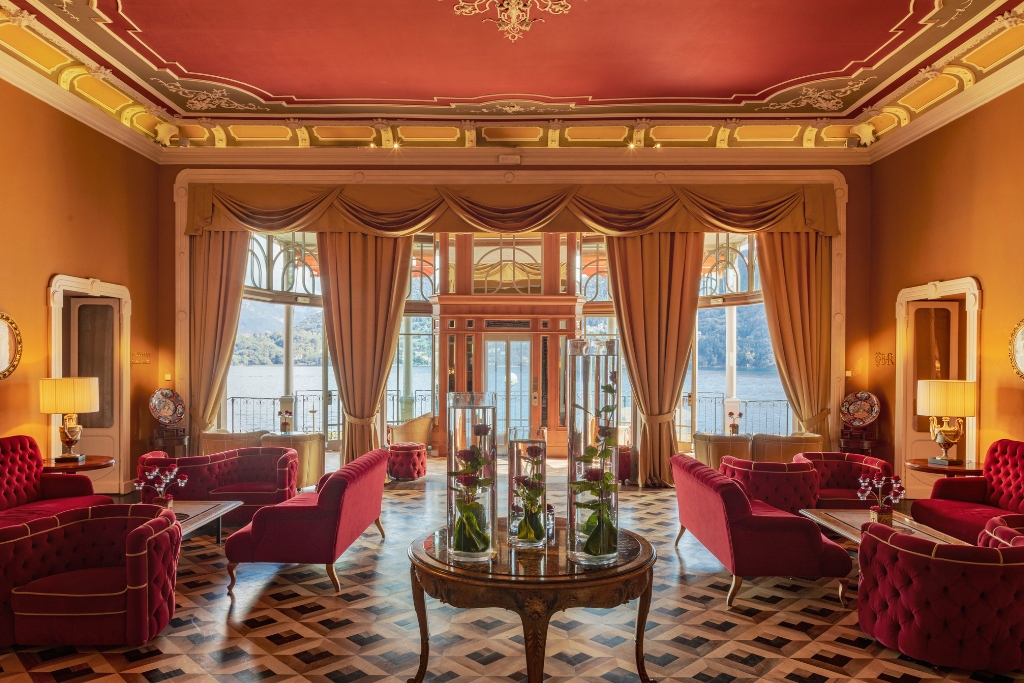 red velvet seating, yellow drapery, and gold accents at grand hotel tremezzo in Lake Como