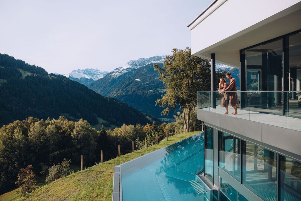 infinity pool with mountains in the background
