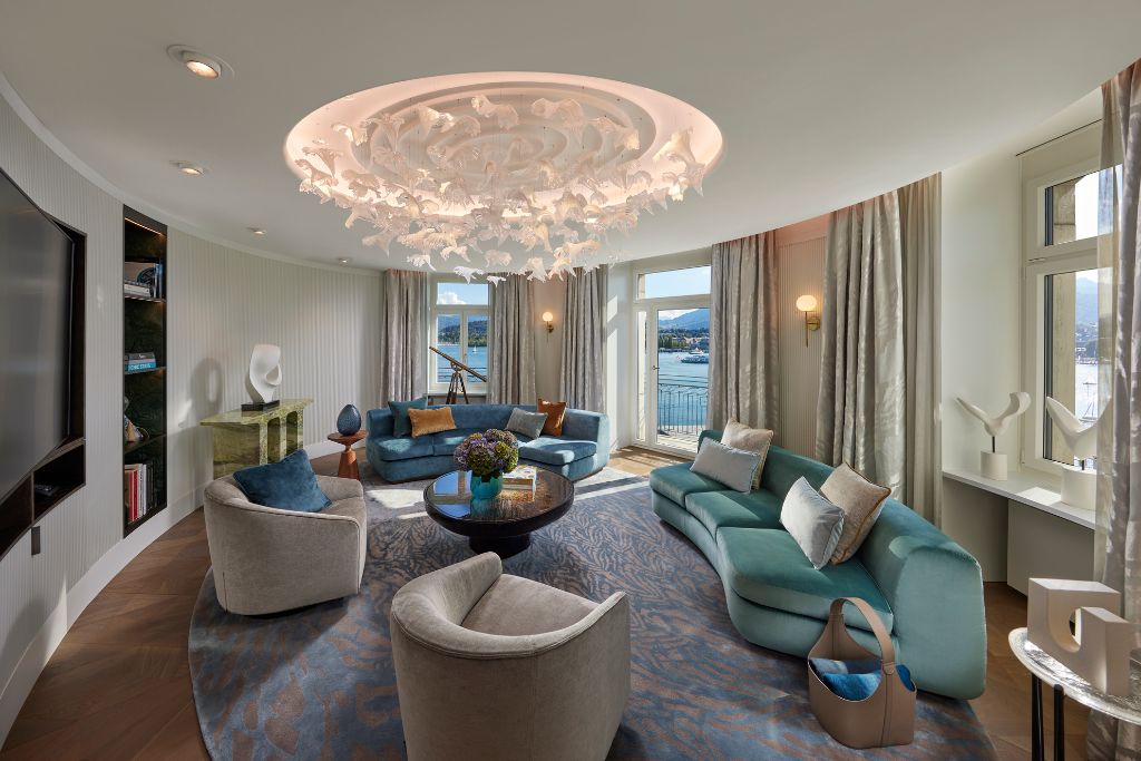 presidential living suite with balcony, lake views, and artist chandelier at mandarin oriental palace, luzern, switzerland
