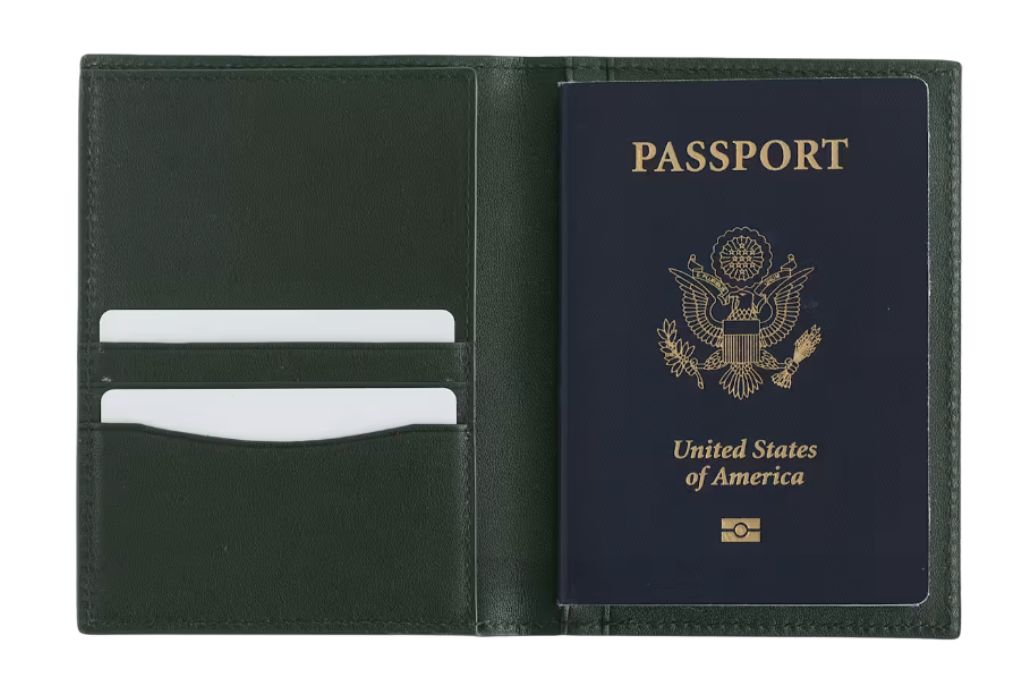 green passport holder with passport