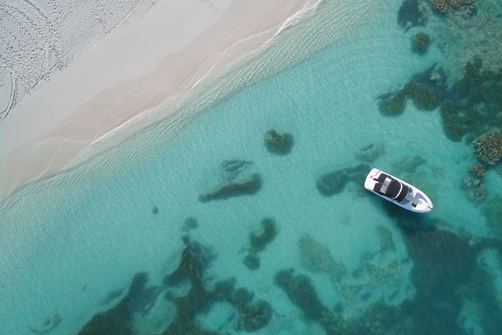 boat overhead photo in the water on the beach