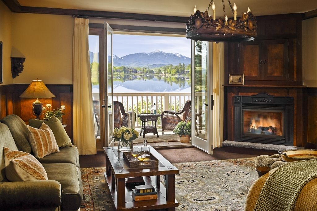 mirror lake inn room interior seating and lake view balcony