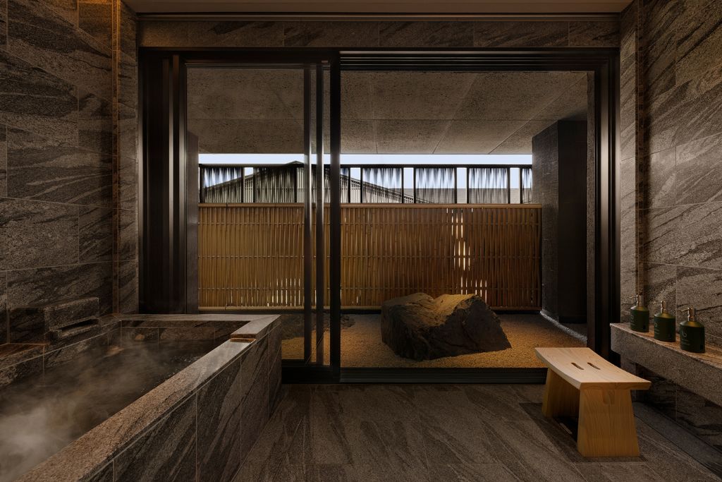 onsen with black and grey stone and natural rocks