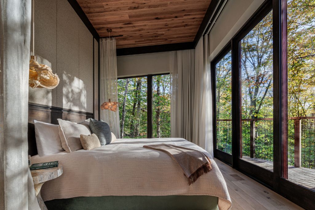 treehouse room bedroom interior with balcony and forest view
