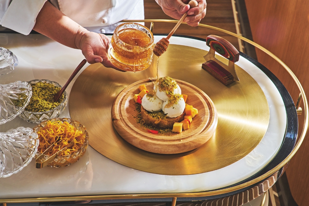 baklava being plated by regent santa monica beach chef