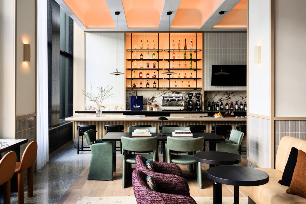 parlour room at the kimpton hotel featuring a bar and sitting spaces