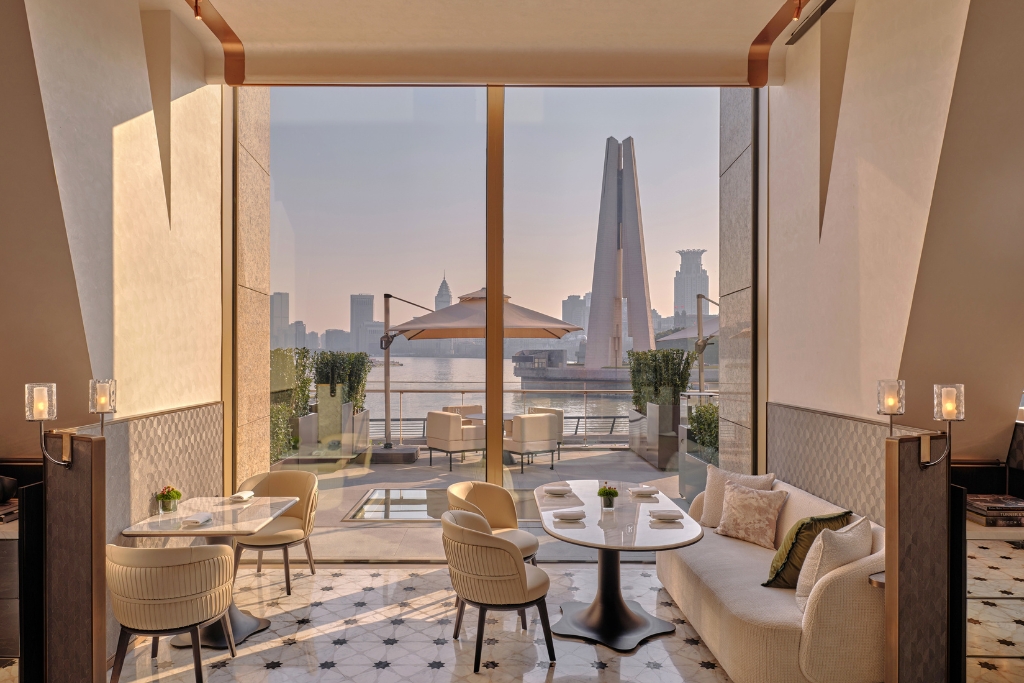 dining area at regent shanghai on the bund overlooking the water and city